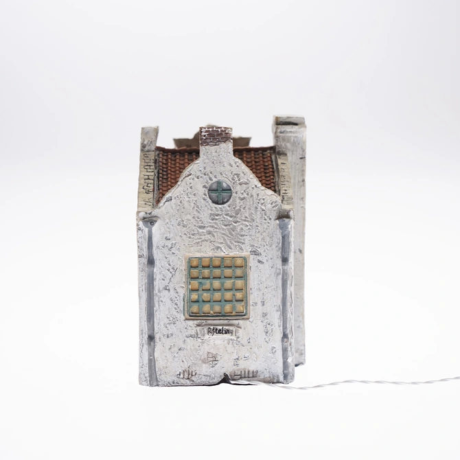 Stenen kip l7.5b8.5h11cm bo links, Luville Efteling achterkant, tuincentrumoutlet